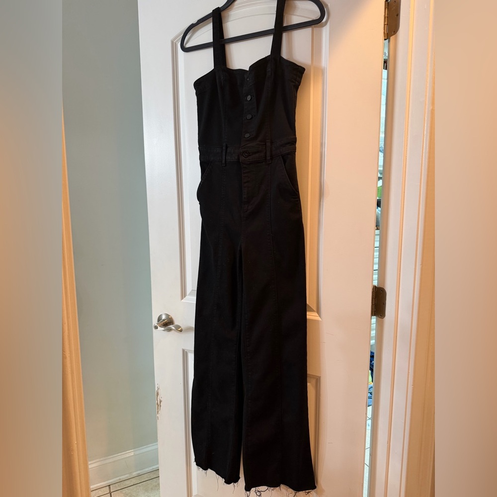 Paige Black denim jumpsuit with straps. Been cut with frayed hem to 29” inseam.